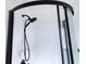 Shower with black shower head and black framed shower door at 3951 Palau Dr, Sarasota, FL 34241