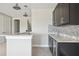 This bar area has custom cabinetry, granite countertops and pendant lighting at 4744 Benito Ct, Lakewood Ranch, FL 34211