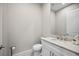 Powder room featuring granite countertop, a large mirror, and modern fixtures at 4744 Benito Ct, Lakewood Ranch, FL 34211