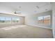 Large bedroom with carpet, ceiling fan, recessed lighting and view of roof at 4744 Benito Ct, Lakewood Ranch, FL 34211