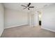 Spacious bedroom with neutral carpet, a ceiling fan, and natural light from the windows at 4744 Benito Ct, Lakewood Ranch, FL 34211