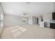 Bright bonus room features a ceiling fan, carpet floors, and a convenient wet bar at 4744 Benito Ct, Lakewood Ranch, FL 34211