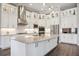 Modern kitchen featuring stone countertops, stainless appliances, and luxury vinyl plank flooring at 4744 Benito Ct, Lakewood Ranch, FL 34211