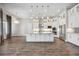 Spacious white kitchen with granite counters, stainless steel appliances, and adjacent dining area at 4744 Benito Ct, Lakewood Ranch, FL 34211