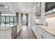 Bright kitchen featuring an island, stainless steel appliances, and opens to the outdoors at 4744 Benito Ct, Lakewood Ranch, FL 34211