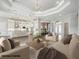 Bright, open-concept living room featuring a modern kitchen, neutral decor, and elegant lighting at 4744 Benito Ct, Lakewood Ranch, FL 34211