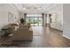 Spacious open concept living room with backyard views, modern furniture and luxury flooring at 4744 Benito Ct, Lakewood Ranch, FL 34211