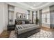 Relaxing bedroom with tray ceiling, patterned curtains and an area rug at 4744 Benito Ct, Lakewood Ranch, FL 34211