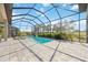 Sparkling pool surrounded by a screened enclosure and stone tile patio at 4744 Benito Ct, Lakewood Ranch, FL 34211