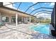 A stunning pool and patio area under a screened enclosure provides ample space for outdoor relaxation at 4744 Benito Ct, Lakewood Ranch, FL 34211