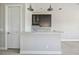 Wet bar featuring granite countertops, a mosaic backsplash, and modern fixtures at 4744 Benito Ct, Lakewood Ranch, FL 34211