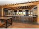 Contemporary bar and lounge interior with stylish high top seating, modern lighting and wooden floors at 4744 Benito Ct, Lakewood Ranch, FL 34211