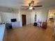 Bright bedroom featuring a large window, built-in desk, and closet, perfect for relaxation and productivity at 5319 Chateau Ln, Bradenton, FL 34207