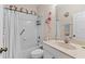 Bright bathroom features shower-tub combo and a playful flamingo theme at 5684 Duval St, Bradenton, FL 34203