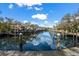Picturesque boat dock with boat lifts on calm water reflecting the blue sky at 5684 Duval St, Bradenton, FL 34203