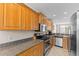 Modern kitchen with stainless steel appliances and granite countertops, a culinary dream at 5684 Duval St, Bradenton, FL 34203