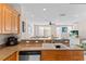 Open-concept kitchen with a view to the living area, fostering Gathering interaction and entertainment at 5684 Duval St, Bradenton, FL 34203