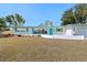 Inviting single-level home with a tidy front yard, turquoise shutters, and a bright, welcoming entrance at 5724 25Th W St, Bradenton, FL 34207