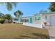 Charming single-story home with turquoise accents, well-maintained lawn, and sunny Florida charm at 5724 25Th W St, Bradenton, FL 34207