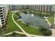 This aerial view shows the location of the condo in relation to the amenities at 5780 Midnight Pass Rd # 303B, Sarasota, FL 34242