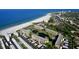 Aerial view of beachfront condos, beach, ocean, and the Gulf of Mexico at 5780 Midnight Pass Rd # 303B, Sarasota, FL 34242