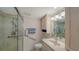 Accessible bathroom features walk-in shower with safety bars, single sink, and a spacious vanity at 5780 Midnight Pass Rd # 303B, Sarasota, FL 34242