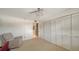 This bedroom has carpet flooring, neutral walls, and a ceiling fan at 5780 Midnight Pass Rd # 303B, Sarasota, FL 34242