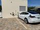 EV charging station on pavers in a community location for electric vehicles at 5780 Midnight Pass Rd # 303B, Sarasota, FL 34242