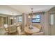 Dining room with table and chairs with mirror accent wall at 5780 Midnight Pass Rd # 303B, Sarasota, FL 34242