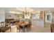 Formal dining room showcases classic wood furniture, decorative mirror, and an inviting atmosphere for entertaining at 5780 Midnight Pass Rd # 303B, Sarasota, FL 34242