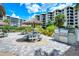 Community picnic area with outdoor kitchen, grills, shaded tables and meticulous landscaping for enjoyable gatherings and relaxation at 5780 Midnight Pass Rd # 303B, Sarasota, FL 34242