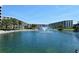 The pond is surrounded by condos and palm trees at 5780 Midnight Pass Rd # 303B, Sarasota, FL 34242
