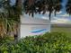 Welcoming sign for Siesta Beach, framed by lush greenery, inviting visitors to enjoy the coastal paradise at 5780 Midnight Pass Rd # 303B, Sarasota, FL 34242