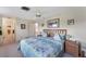 Carpeted main bedroom featuring a double bed, windows, closet and door to bath at 7102 W 18Th W Ave, Bradenton, FL 34209