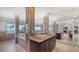 Beautiful bathroom with dual sinks, tiled columns, and a jacuzzi tub with bay views at 741 Hideaway Bay Dr, Longboat Key, FL 34228