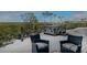 Relaxing deck area with hot tub and comfortable seating overlooking scenic waterfront views at 741 Hideaway Bay Dr, Longboat Key, FL 34228