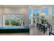 Dining area boasts of large windows, banquette seating, and elegant lighting at 741 Hideaway Bay Dr, Longboat Key, FL 34228