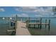 Dock with a boat lift and beautiful water views at 741 Hideaway Bay Dr, Longboat Key, FL 34228
