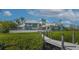 Stunning waterfront property featuring a private dock and well-maintained landscaping at 741 Hideaway Bay Dr, Longboat Key, FL 34228