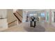 Spacious foyer with a staircase, tile flooring, and views of the living area and waterfront at 741 Hideaway Bay Dr, Longboat Key, FL 34228
