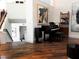 Spacious living room with hardwood floors, a piano, modern art, and a staircase leading to another floor at 741 Hideaway Bay Dr, Longboat Key, FL 34228
