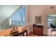 Hallway space features water views from a large window plus a cabinet with decor pieces at 741 Hideaway Bay Dr, Longboat Key, FL 34228