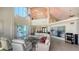 Bright living room featuring high ceilings, modern furnishings, and elegant decor at 741 Hideaway Bay Dr, Longboat Key, FL 34228
