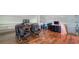 Large loft space with hardwood floors, dual desk areas, and comfortable seating for work or relaxation at 741 Hideaway Bay Dr, Longboat Key, FL 34228