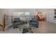 Cozy upper level sitting area with comfortable chairs and plenty of natural light at 741 Hideaway Bay Dr, Longboat Key, FL 34228