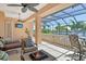 Balcony with a seating area, outdoor dining set, and a fire pit with views of the inter-coastal waterway at 1007 3Rd E St, Palmetto, FL 34221