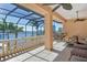 Spacious screened balcony features tile flooring, views of the water and boats, and outdoor seating at 1007 3Rd E St, Palmetto, FL 34221