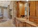 A luxurious bathroom boasts custom wood cabinetry and marble countertops throughout the space at 1007 3Rd E St, Palmetto, FL 34221