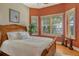 Bedroom with neutral walls, shuttered windows with water views, and wood floors, creating a serene retreat at 1007 3Rd E St, Palmetto, FL 34221