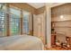 Comfortable bedroom featuring a private office space and plantation shutters at 1007 3Rd E St, Palmetto, FL 34221